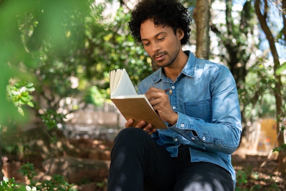 man-journaling-types-writing-outside.jpg